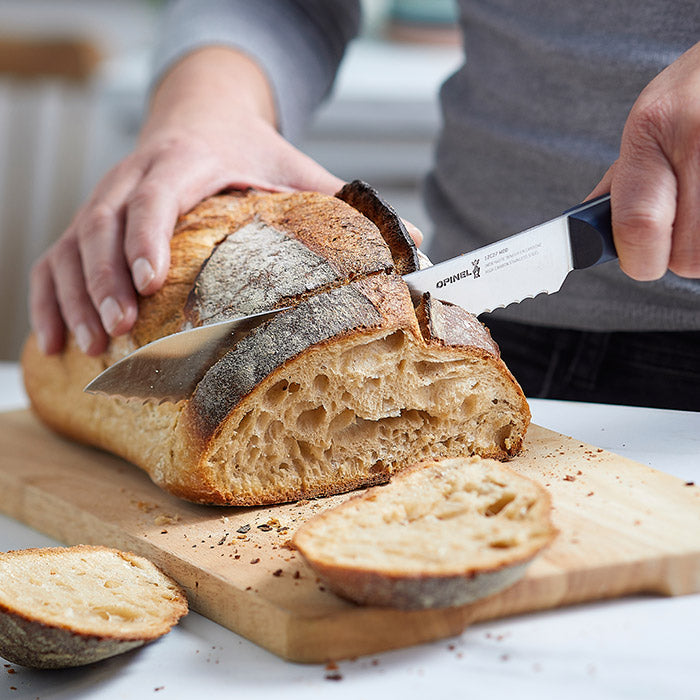 Opinel Knife Cutting Bread