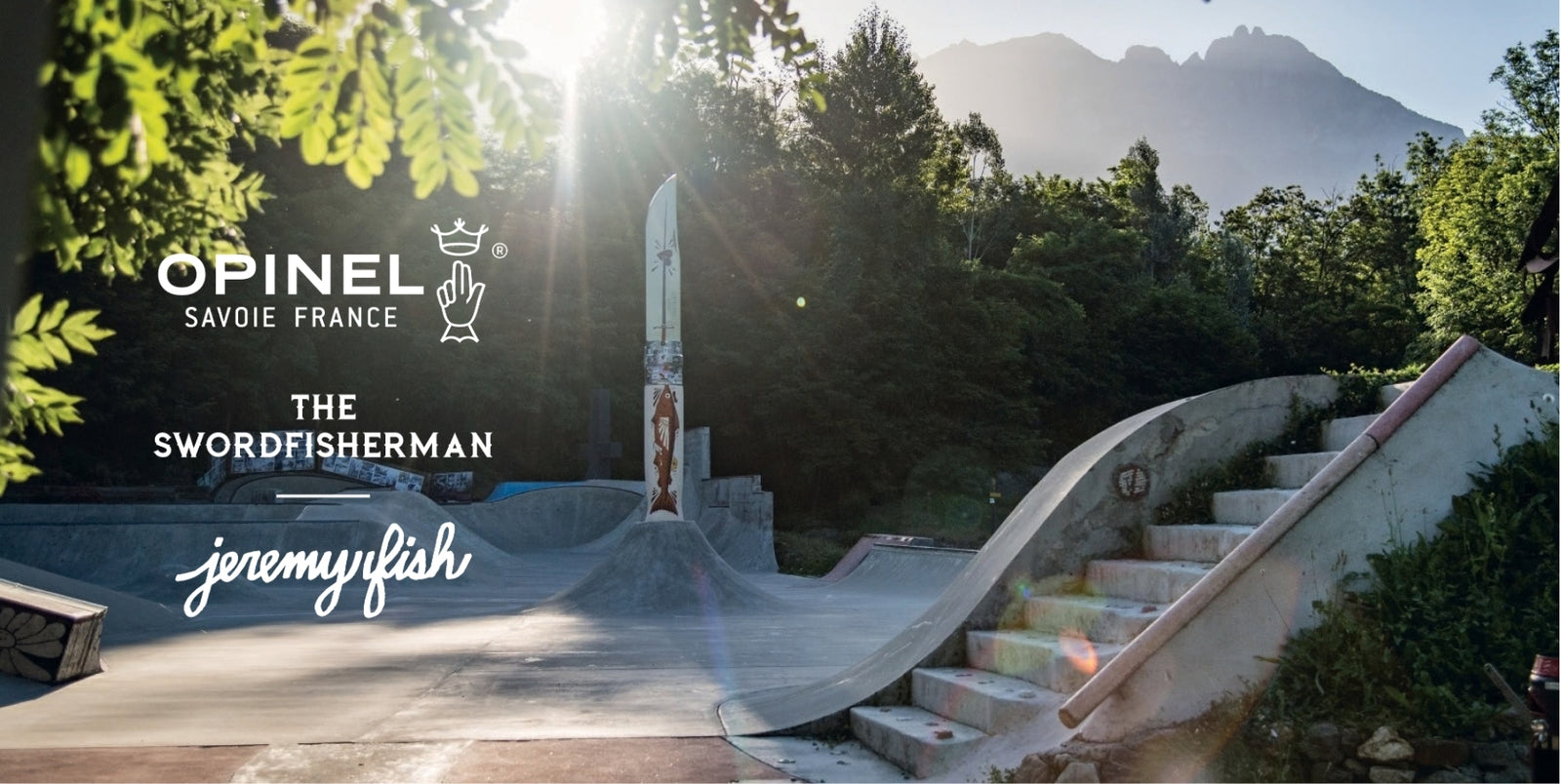 Outdoor promotional scene at a concrete skatepark with mountains and trees in the background and a tall knife. Visible text includes 'OPINEL SAVOIE FRANCE', 'THE SWORDFISHERMAN', and 'jeremyfish'.