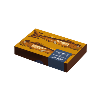 A rectangular product box with illustrated fish on a mustard-yellow top, dark brown sides, and a blue wrap label reading 'OPINEL' and 'Swordfishman'.