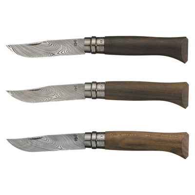 Three folding pocket knives with Damascus steel blades and dark wood handles, arranged horizontally on a plain white background.